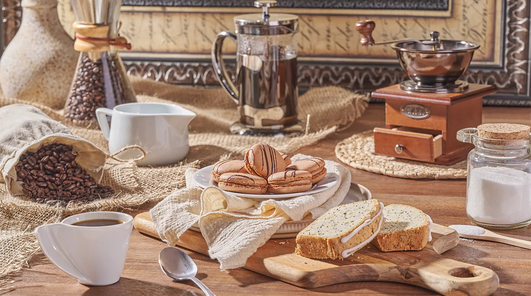 Coffee, macarons, and baked treats arranged on a rustic table for Rhode Island gift basket delivery.